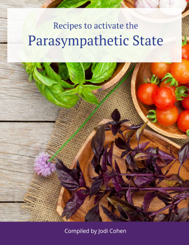 Fresh ingredients including basil and tomatoes on a rustic wooden table, hinting at wholesome and aromatic recipes within the pages of a cookbook titled "parasympathetic state" compiled by jodi cohen.