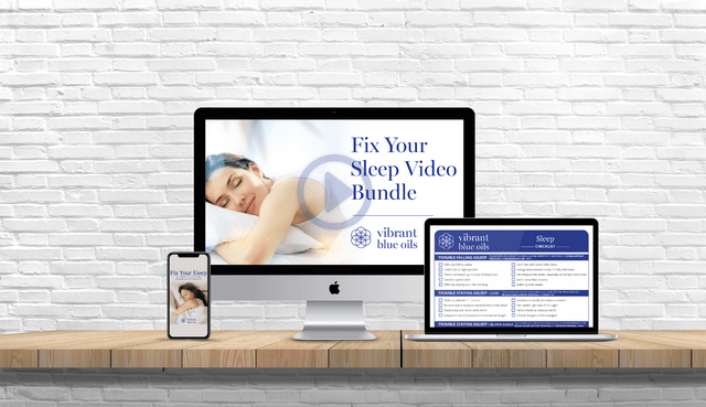 A modern workspace featuring an imac and macbook displaying content focused on a "fix your sleep video bundle" against a brick wall background.